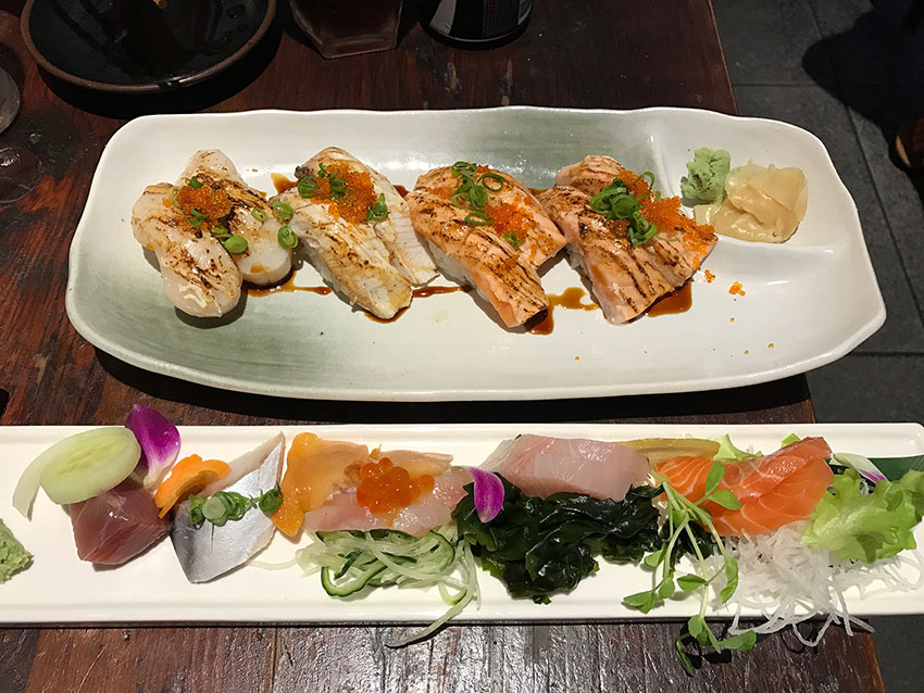 Plate of sashimi and plate of aburi sushi