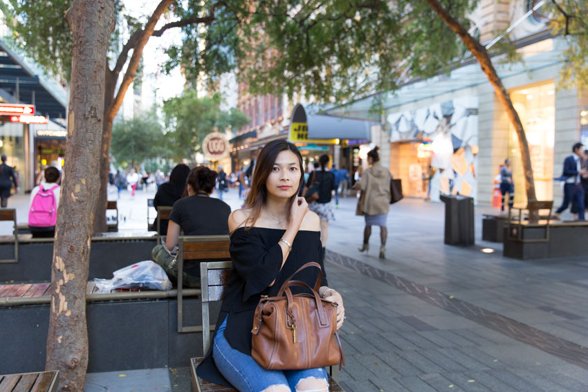 Me sitting on some interestingly-arranged seating in Pitt Street Mall