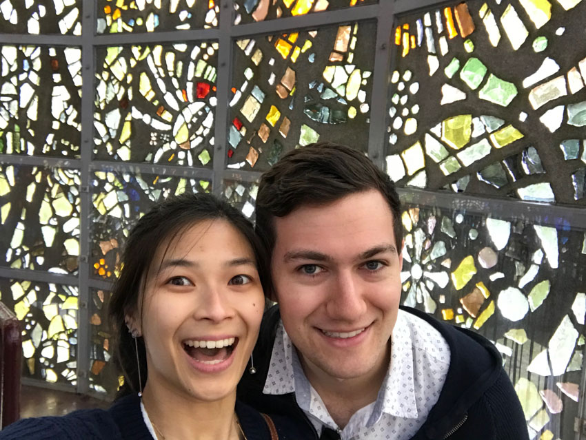 A selfie of me and Nick inside the tower with the stained glass in the background