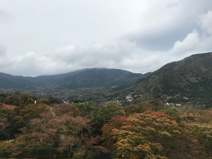 A scenic view of Hakone as seen from the top of the tower, with clouds filling the sky