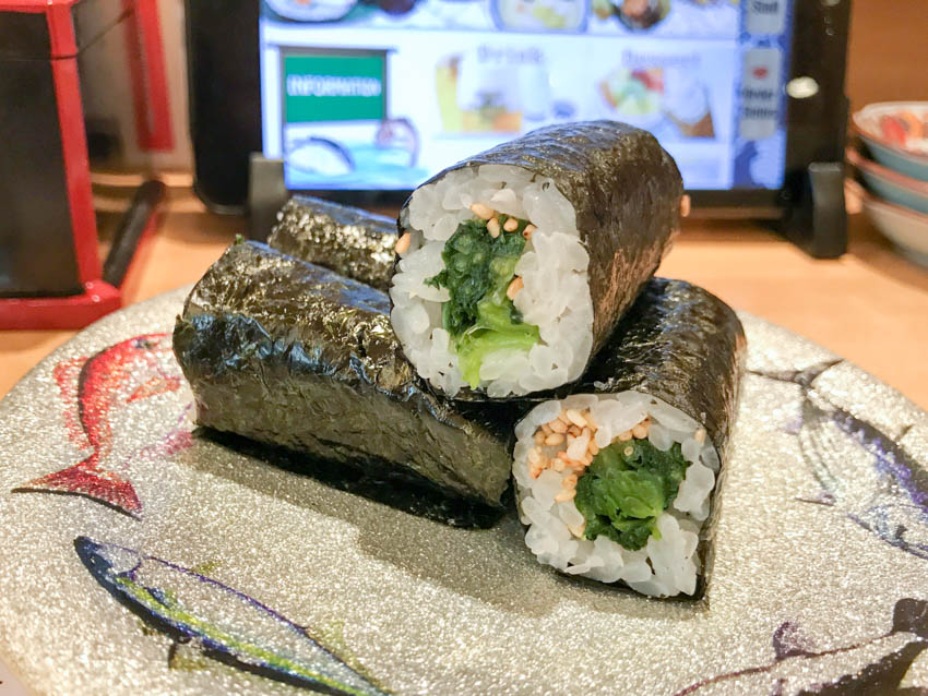 Three small sushi rolls of Hiroshima greens
