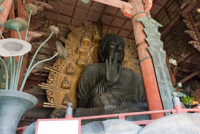 A big stone buddha located at the entrance of the temple