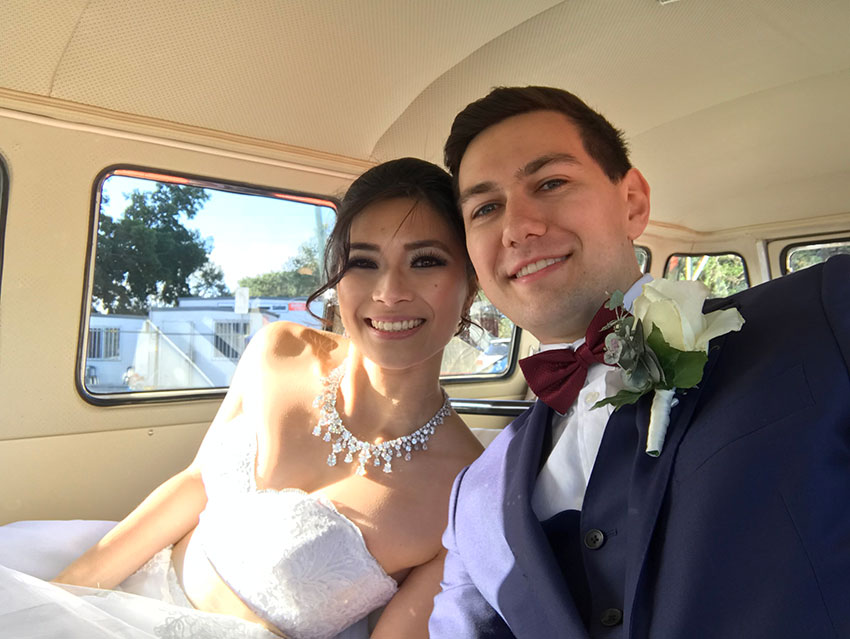 Nick and I sitting in our kombi van on our wedding day