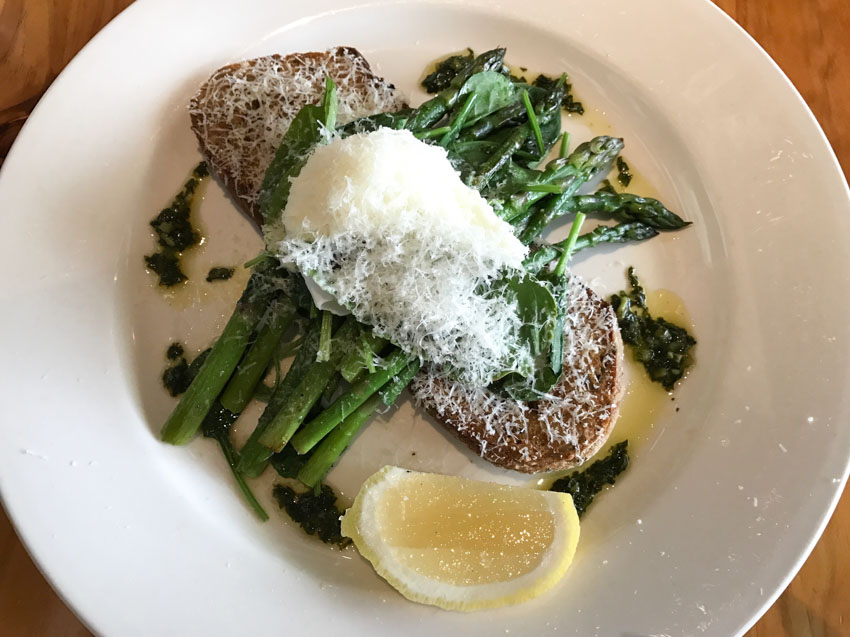 Asparagus, spinach and a poached egg with parmesan, on top of toast