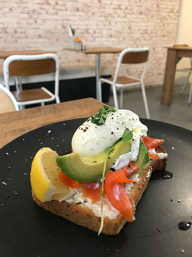Smoked salmon, a poached egg, and avocado on gluten free bread