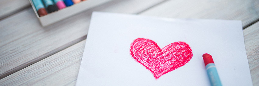 Love heart drawn on paper with crayon