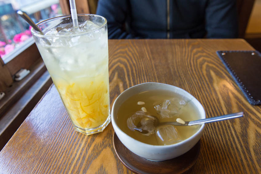 A glass of yuzu ice tea and a cup of plum tea