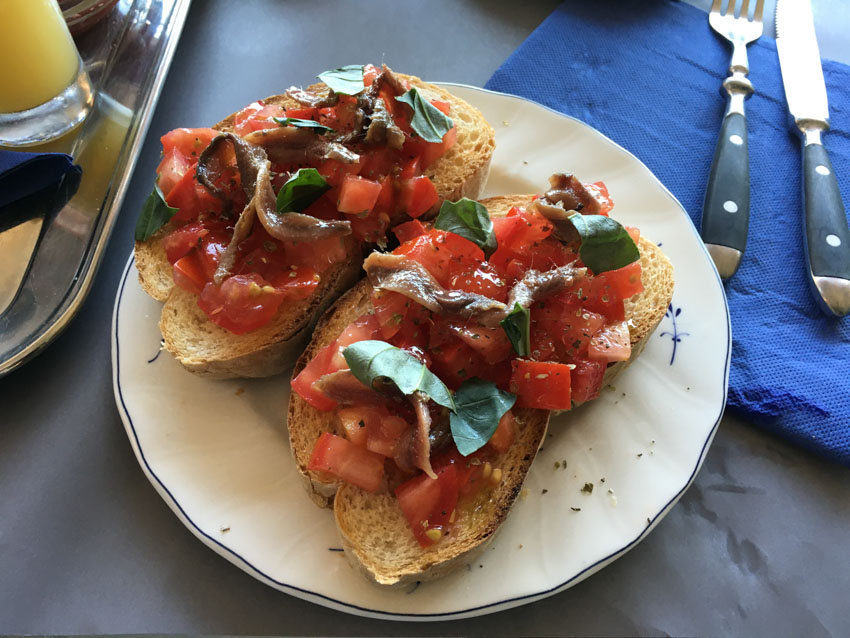 Tomato and anchovy bruschetta for breakfast