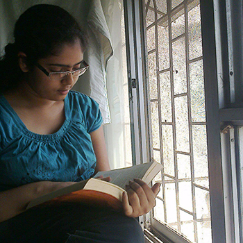 Bhairavee reading a book