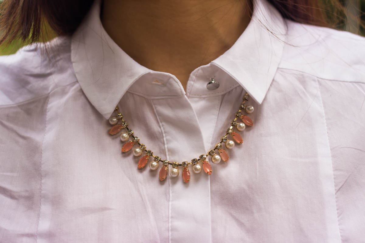 Close up of pink stone and pearl necklace