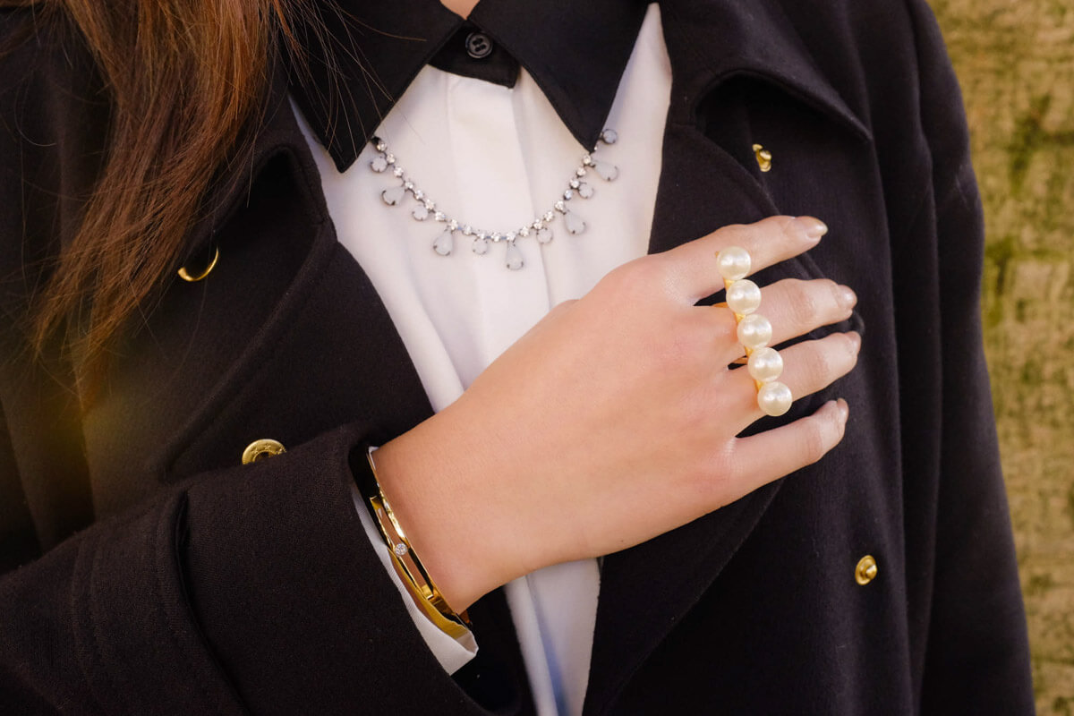 Close-up of ring, bangle and collar + necklace