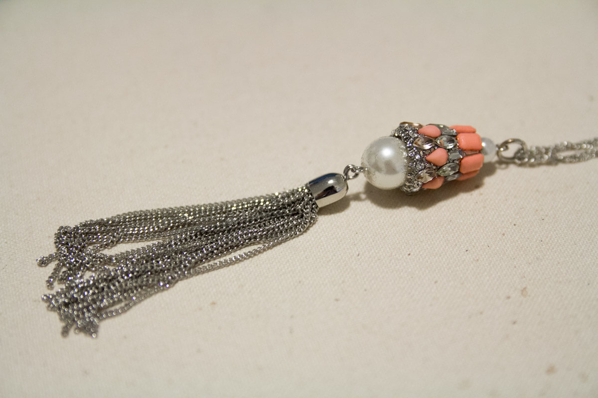 Another photo of the Char Necklace, showing its tassel