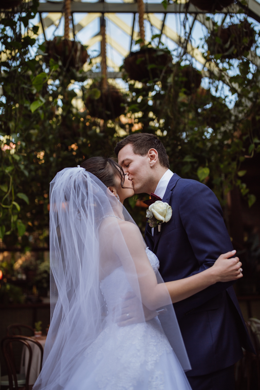 A bride and groom kissing