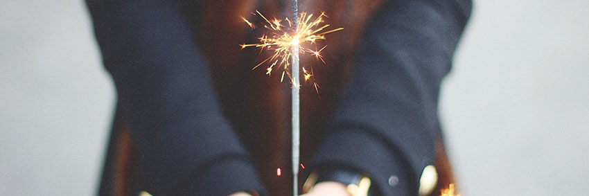 Person holding sparklers