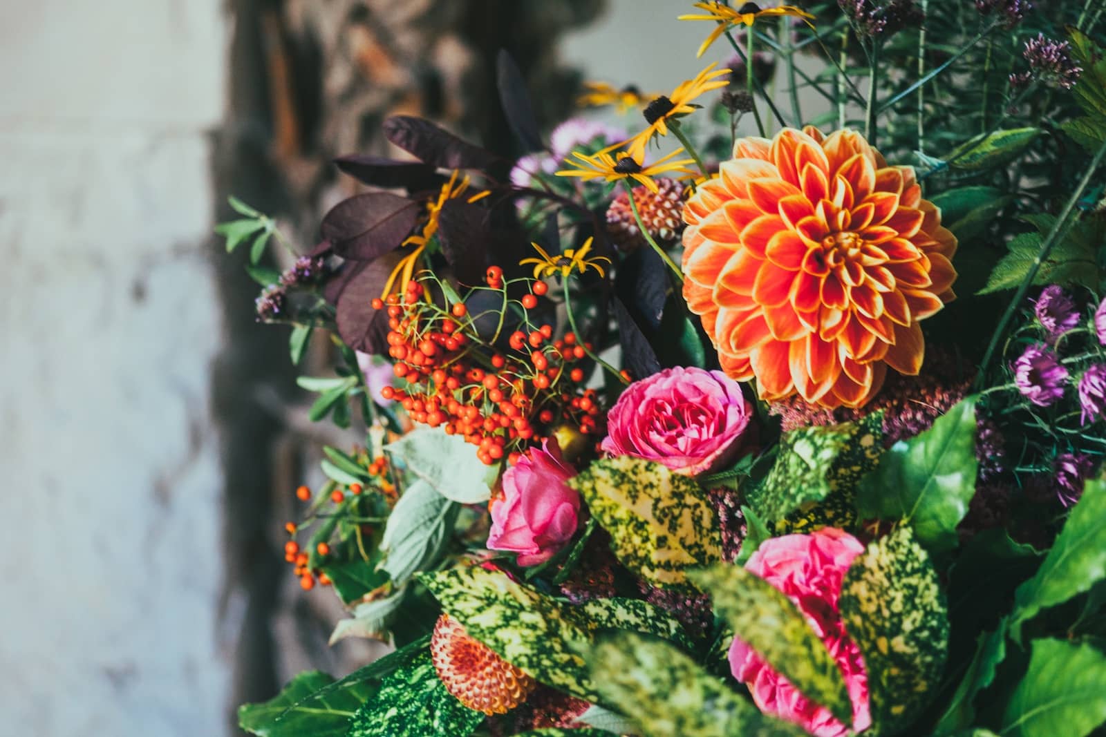 A bouquet of brightly coloured flowers of pink and orange