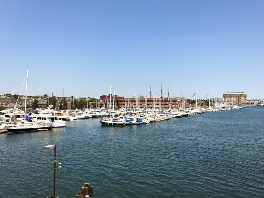 A group of colourful boats closely parked in a harbour