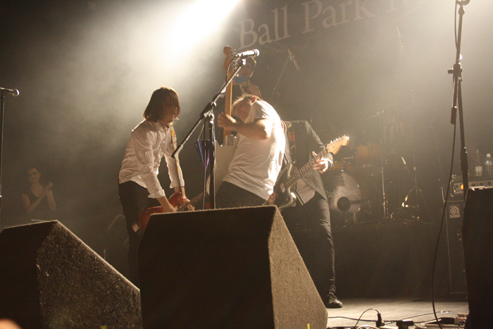 Brock, Dean, and Lindsay McDougall battling it off in a guitar competition