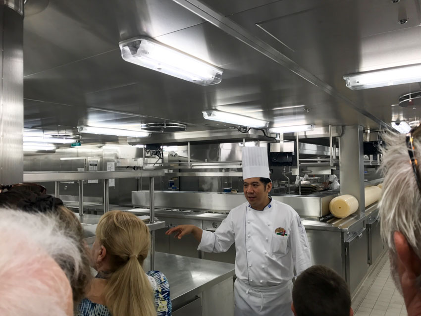 The chef telling us about the duties of the kitchen crew