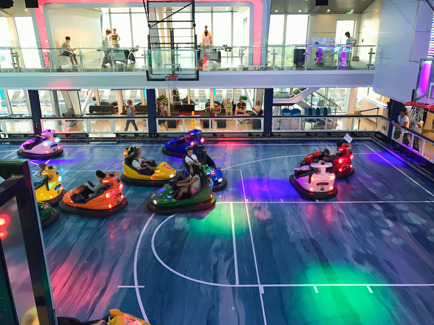 Bumper cars on a court, mid-action