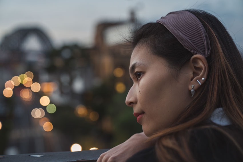 Close up shot of me looking over the railing with the harbour bridge in the background