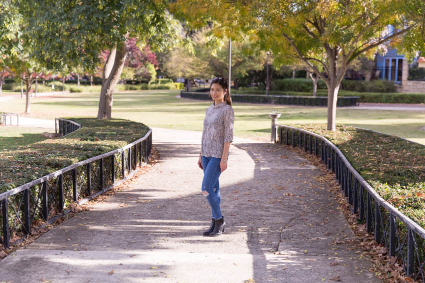 Me standing in the middle of a path with some trees and hedges down the sides