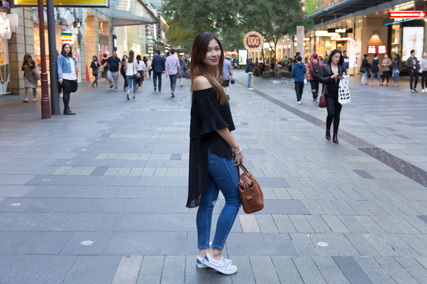 Me standing side-on in the mall to show the length of the back of my top