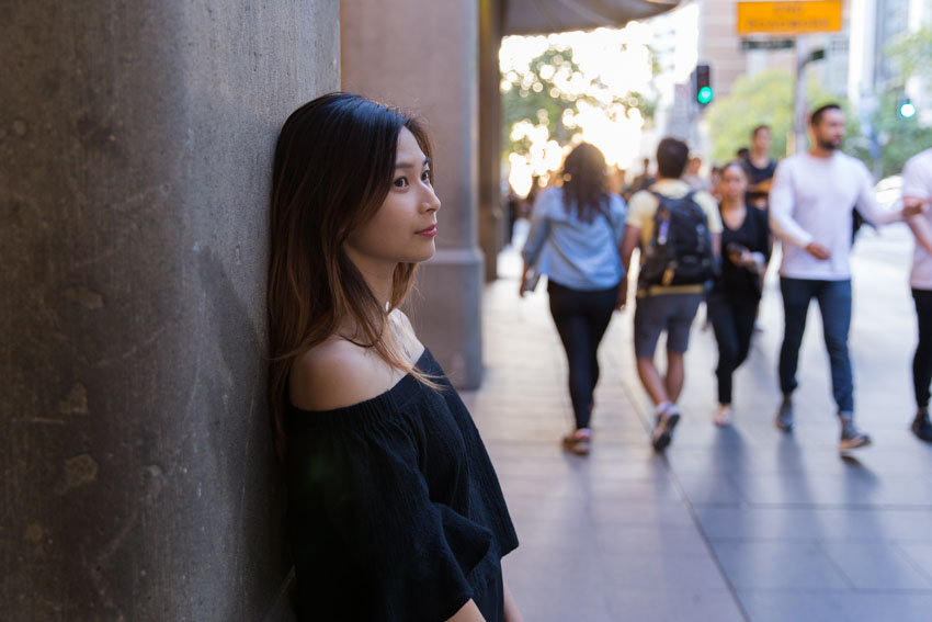 Me leaning against a pillar with some streets in the background