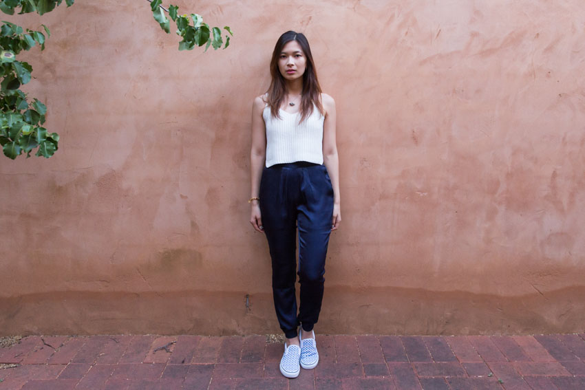 Full body shot of me standing in front of a light brown-red wall