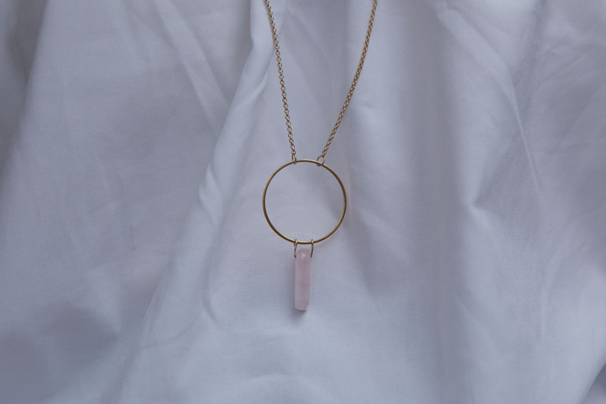 Close up of rose quartz halo necklace