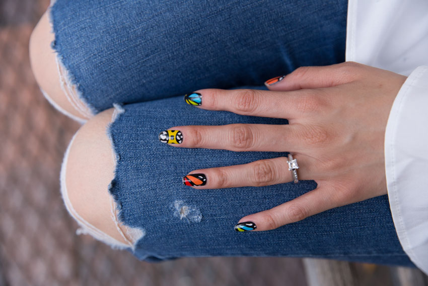 Close up of butterfly-style nail wraps applied to my nails