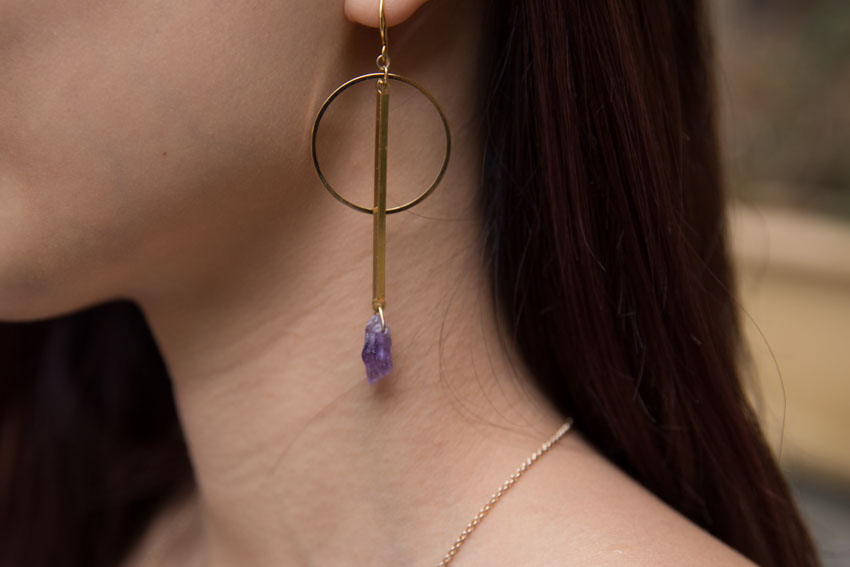 Close up of purple amethyst earrings