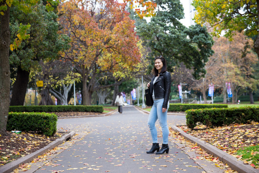 The woman in the previous photos on this webpage, wearing the same outfit and in the same setting. She is looking at the camera and smiling but her left side is tilted to the camera