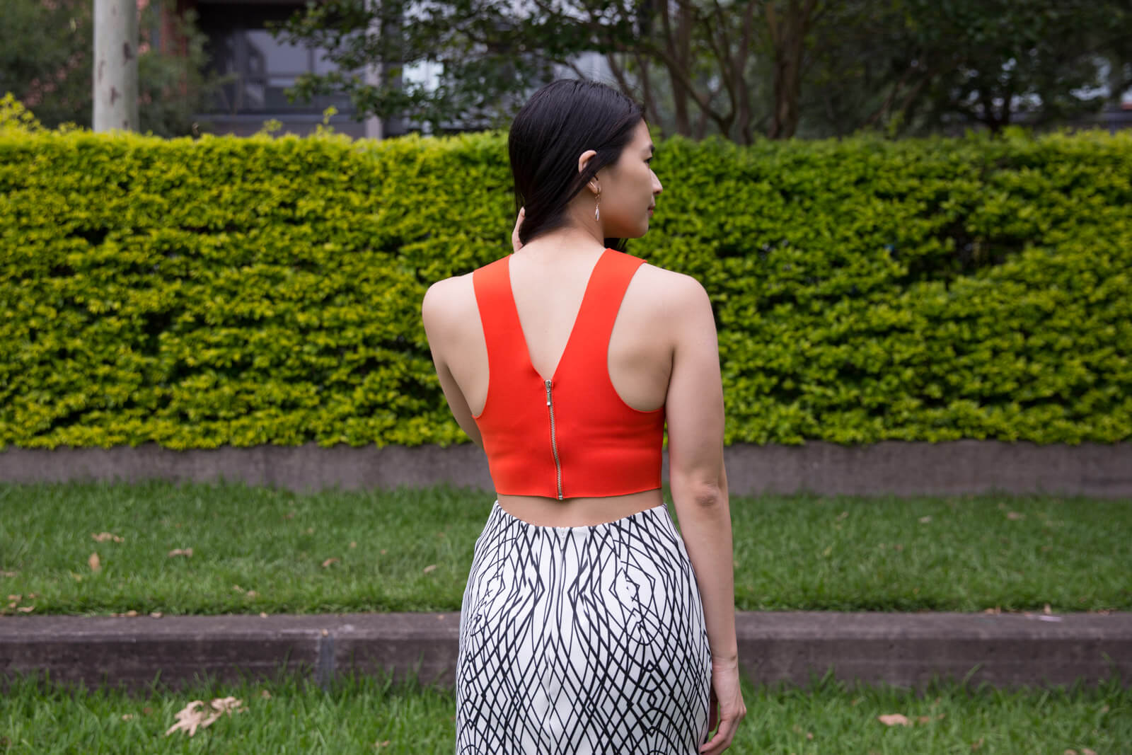 The same woman from other photos in this post, from the back, showing the back of her sleeveless top