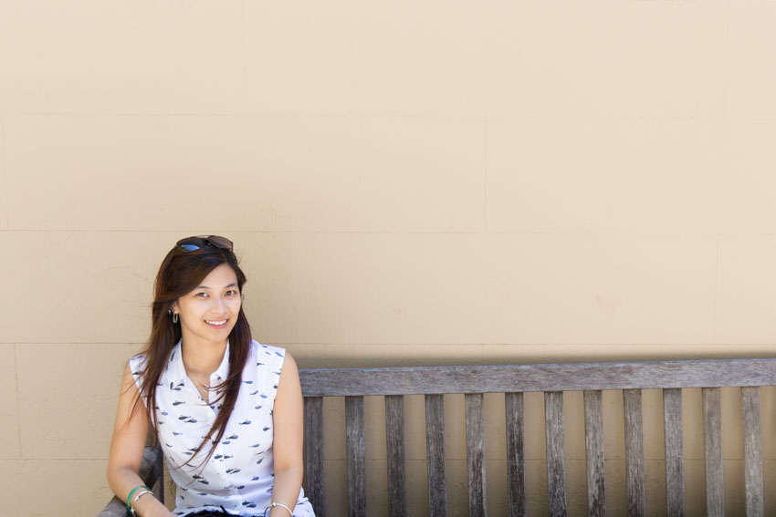 Me sitting on a wooden bench wearing my whale shirt