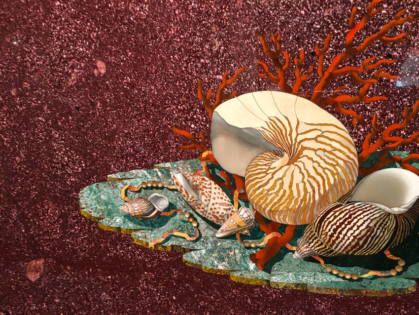 A detailed precious stone mosaic of a shell