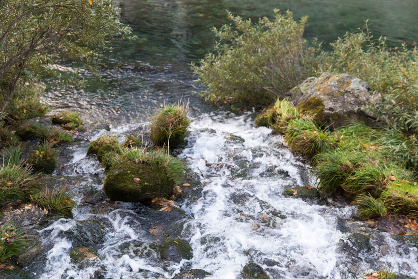 A close-up of the river’s water hitting the rocks