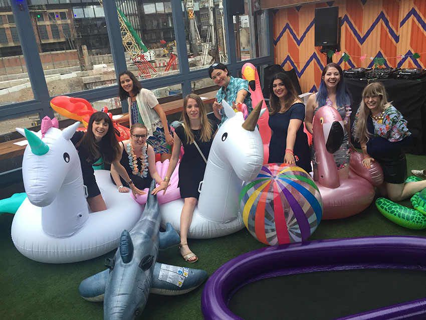 Amy and some of the girls from the Twitter team at their summer party with some inflatables