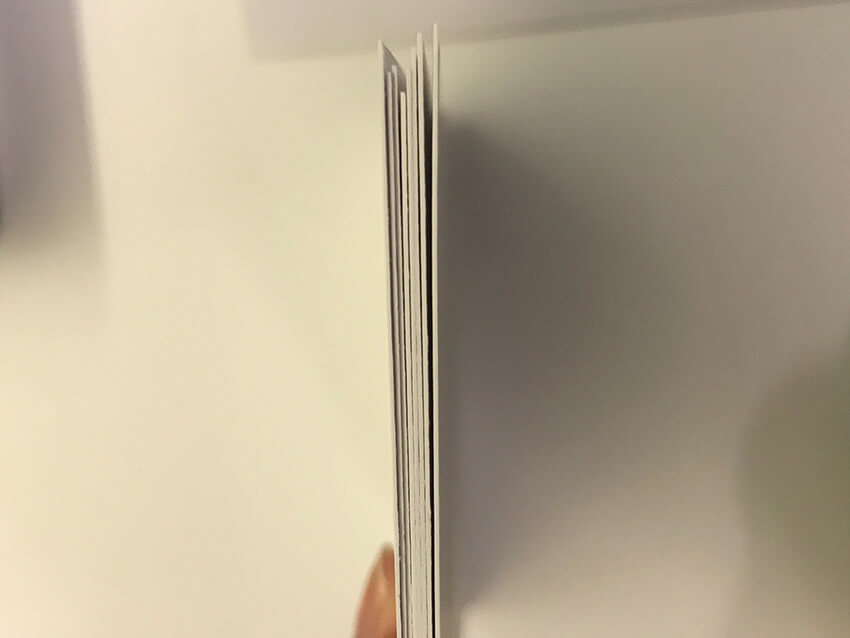 A stack of thick card as seen from the side.