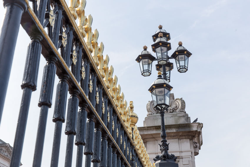Low angle close up shot of the gates of Buckingham Palace