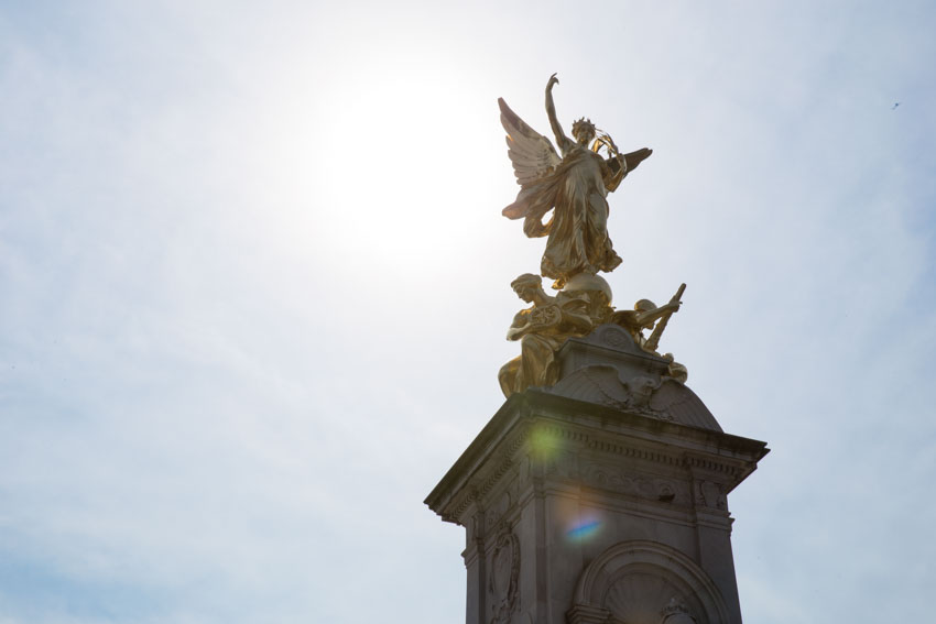 A golden statue on top of a pillar