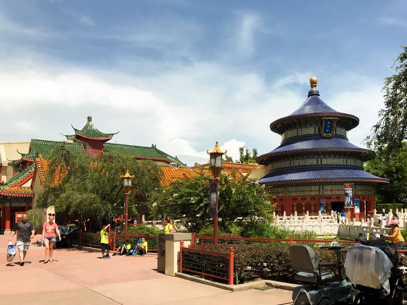 Asian-inspired buildings, with some small trees, on a clear day