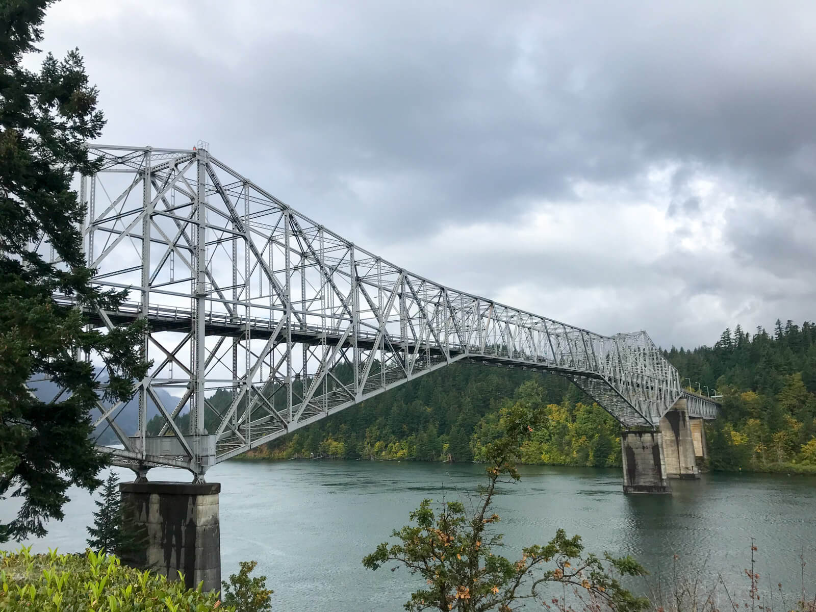 A big steel structured bridge spanning the width of a large river