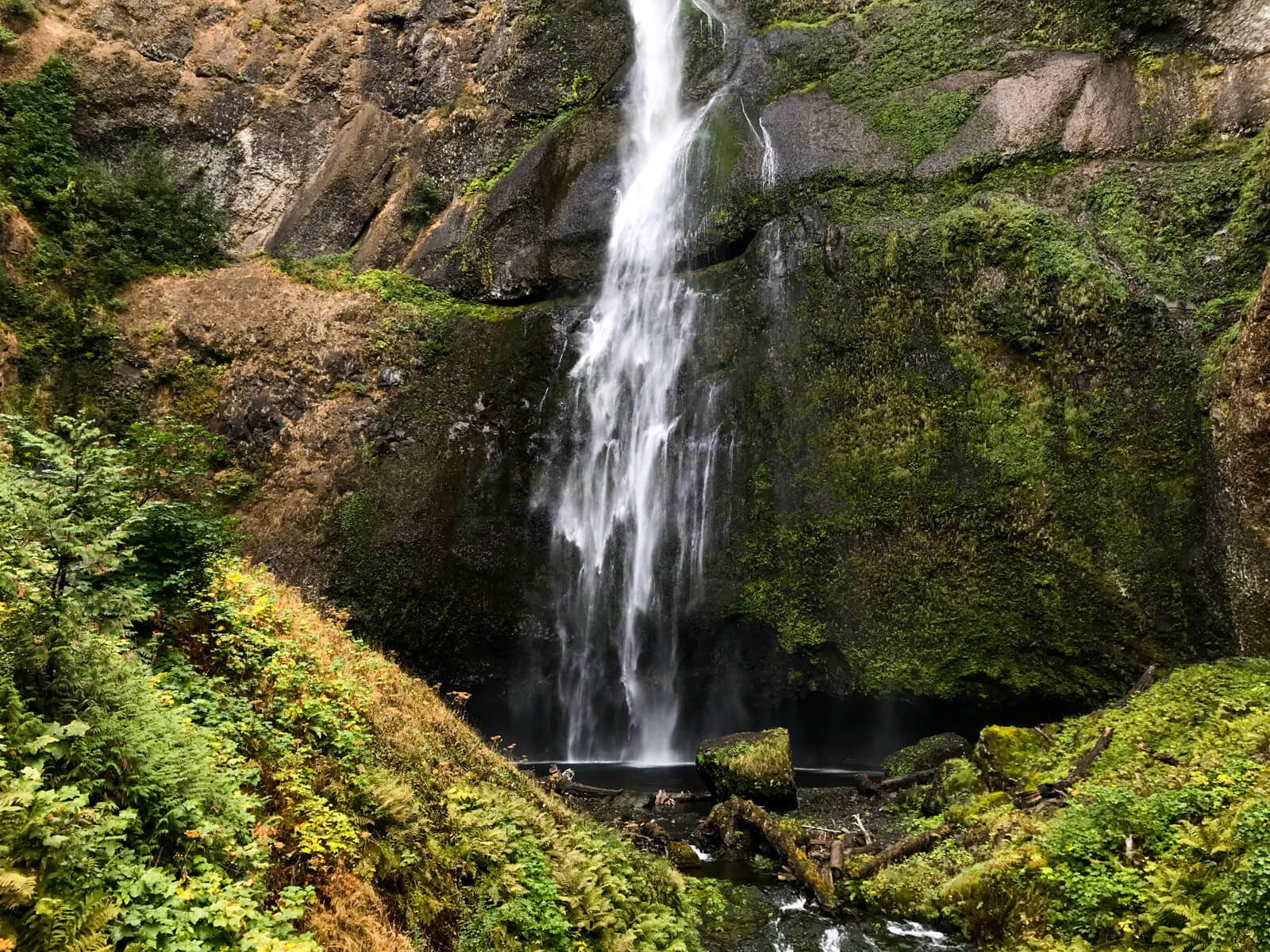 The same waterfall in other images on this page, but only the bottom half is seen as the water hits the bottom.