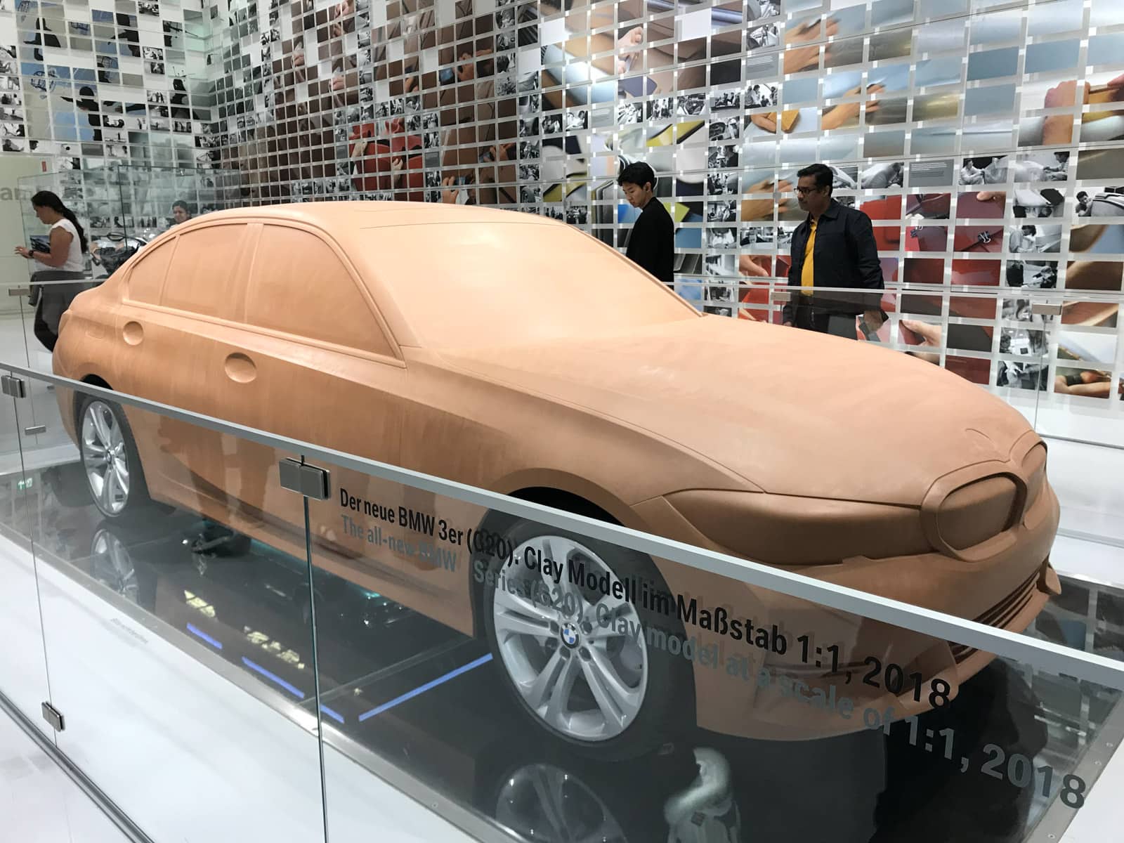 A clay model of a car inside a museum