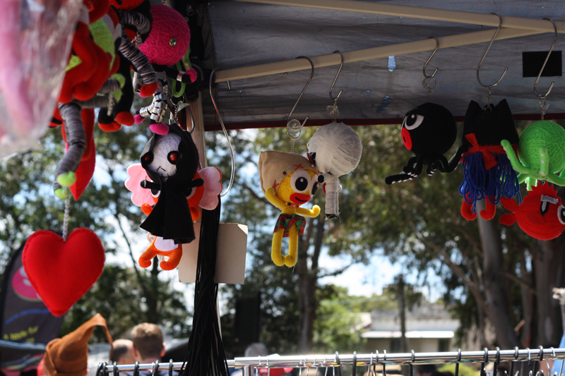 Cute voodoo dolls hanging from a stall