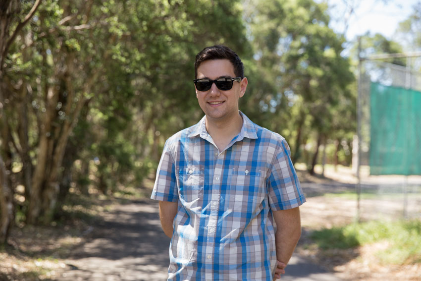 Standing in the park with sunglasses on