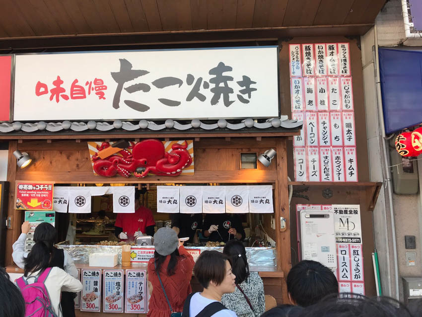 A squid sculpture above the store in Shinsekai that sold different flavours of takoyaki