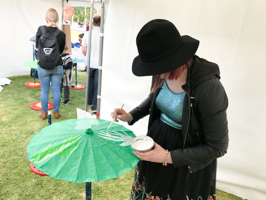 Kim painting cacti on her umbrella