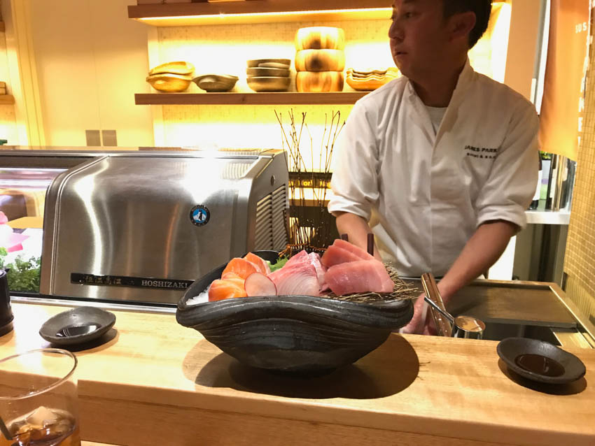 The chef who prepared our sashimi, with the sashimi bowl