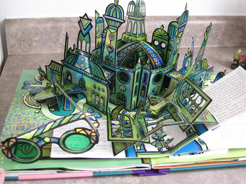 A pretty complex pop-up book of a green-and-blue coloured castle